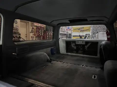 Classic Chevy Suburban window tint: Installed 5% on the two front doors and the rear hatch, Installed 15% on the rear doors and rear cargo windows (view 5)