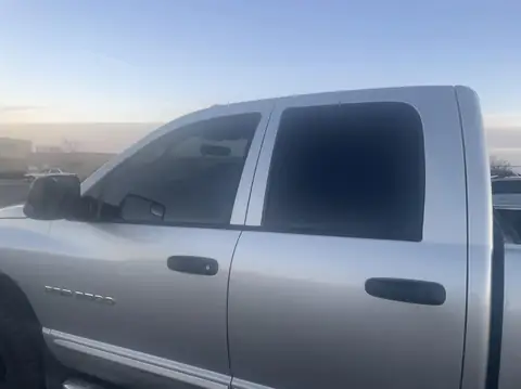 Dodge Ram window tint: Old tint removed from front windows, New 35% Premium installed (view 2)
