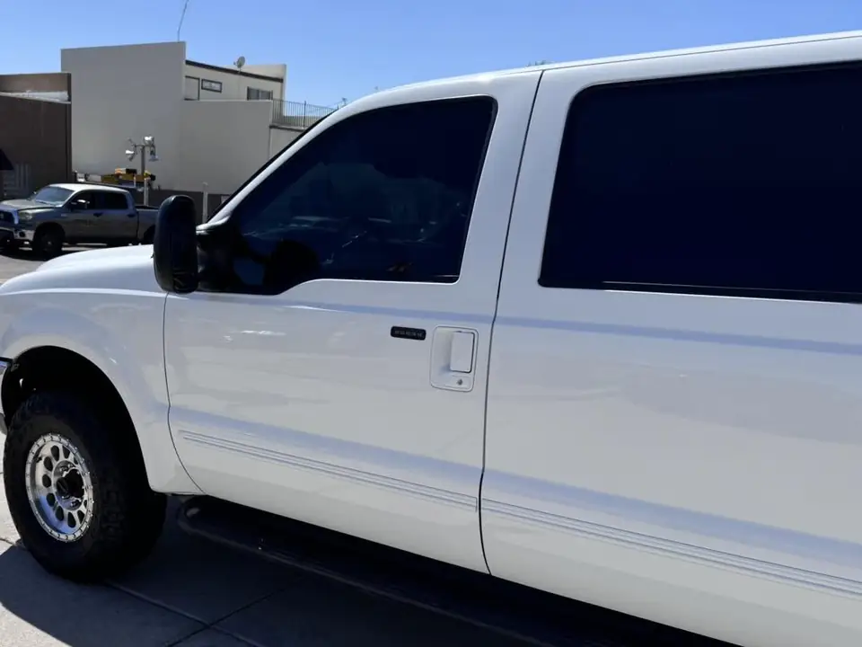 Ford Excursion window tint: Remove faded film on front doors, New 15% front doors, 50% full windshield, 5% sun strip (view 2)