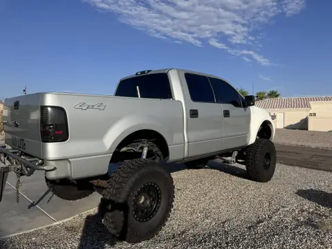 Ford F-150 window tint: Removed the faded tint off the 2 front windows, Installed our 5% Carbon Ceramic on the rear 3 windows, 15% Carbon Ceramic