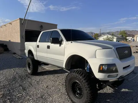 Ford F-150 window tint: Removed the faded tint off the 2 front windows, Installed our 5% Carbon Ceramic on the rear 3 windows, 15% Carbon Ceramic (view 2)