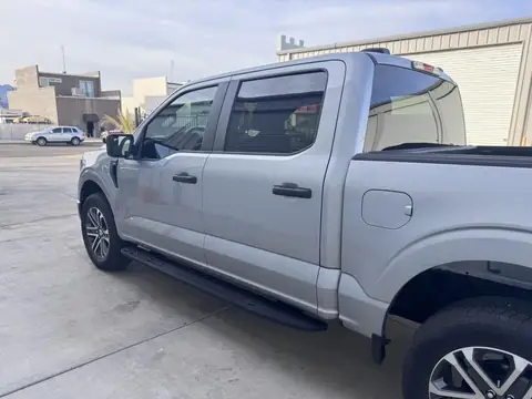 Ford F-150 window tint: Removal on 4 doors, Added a layer of 20% C-IR on the rear window privacy glass, 5% C-IR on the 4 doors and sunstrip