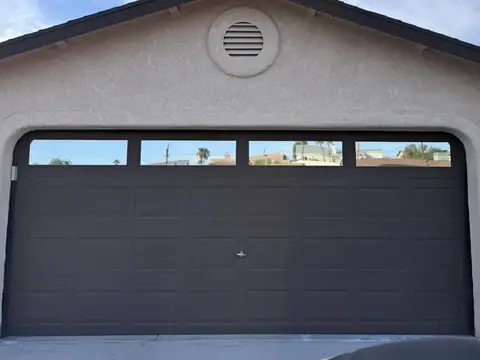 Garage door windows in 5% dual reflective film: Tired of the sun beating through while trying to do some work in the garage/shop? Give us a call for (view 2)