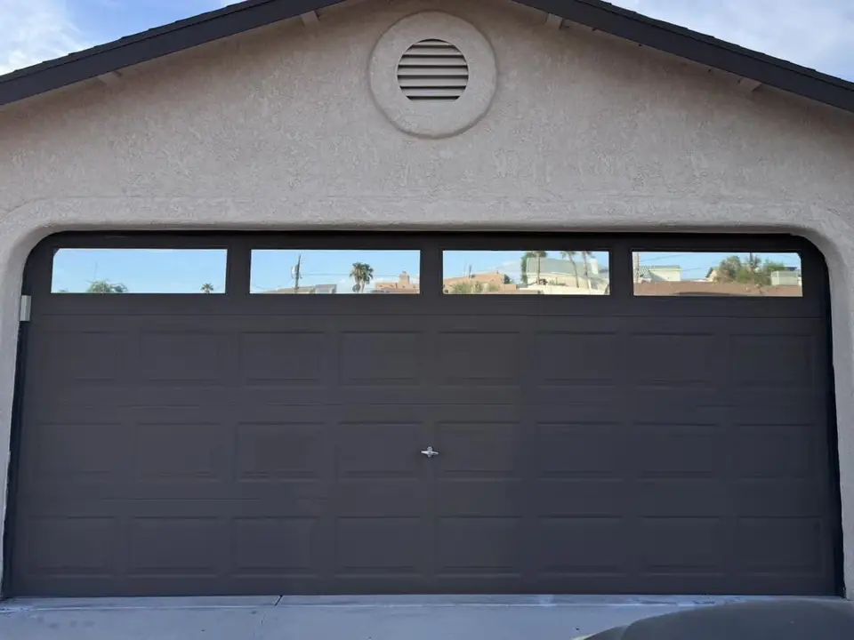 Garage door windows in 5% dual reflective film: Tired of the sun beating through while trying to do some work in the garage/shop? Give us a call for (view 2)