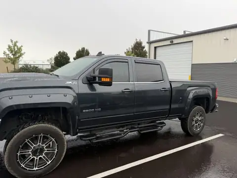 GMC Sierra 2500HD window tint: Removed the old failing dyed film and installed 35% carbon on the front two doors, at the shop in Prescott Valley
