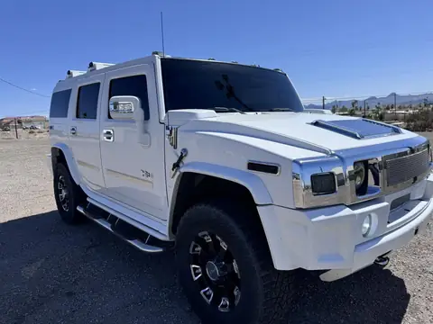 Hummer H2 window tint: Full removal of old film, New 5% ceramic sides and rear, 50% full windshield, 5% sunstrip