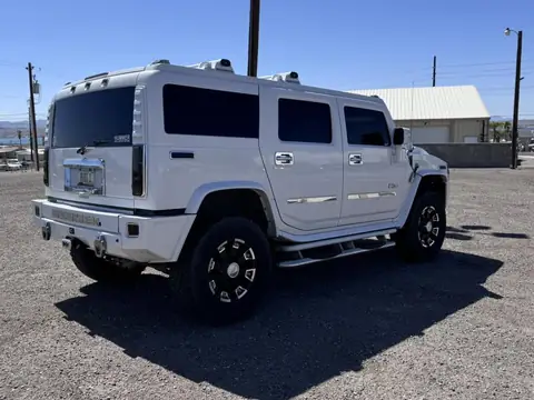 Hummer H2 window tint: Full removal of old film, New 5% ceramic sides and rear, 50% full windshield, 5% sunstrip (view 2)