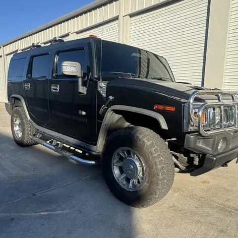 Hummer H2 window tint: Remove old film from front doors, New 5% C-IR sides and rear hatch, 50% C-IR full windshield (view 2)