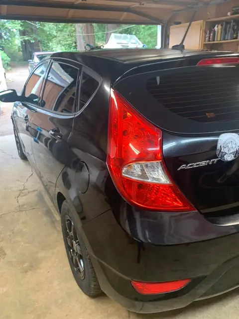 Hyundai Accent smoked taillights and front door tint: Hyundai Accent in for VViViD premium bio pulse hex+ smoke on the taillights and 25% on the