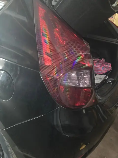 Hyundai Accent smoked taillights and front door tint: Hyundai Accent in for VViViD premium bio pulse hex+ smoke on the taillights and 25% on the (view 2)