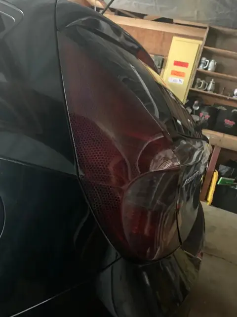 Hyundai Accent smoked taillights and front door tint: Hyundai Accent in for VViViD premium bio pulse hex+ smoke on the taillights and 25% on the (view 3)
