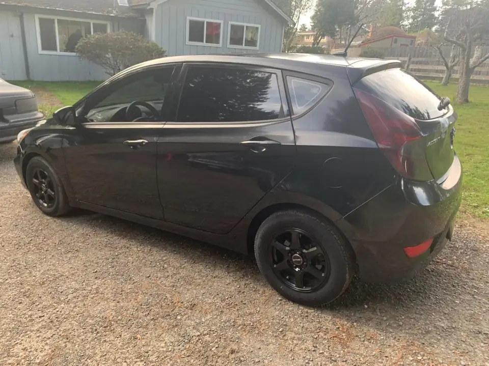 Hyundai Accent smoked taillights and front door tint: Hyundai Accent in for VViViD premium bio pulse hex+ smoke on the taillights and 25% on the (view 4)