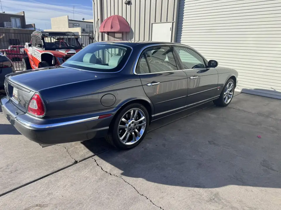 Jaguar sedan window tint: 15% rear half, 35% front doors, 5% sunstrip (view 2)