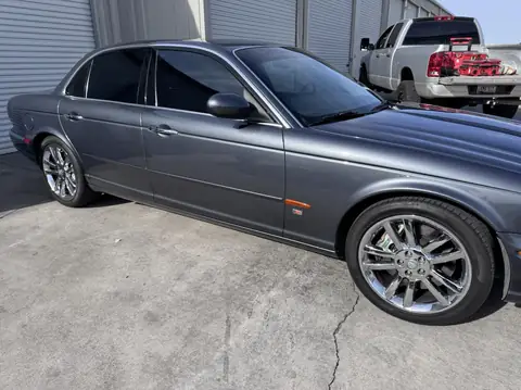 Jaguar sedan window tint: 15% rear half, 35% front doors, 5% sunstrip (view 4)