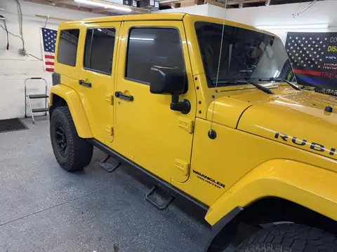 Jeep Wrangler Rubicon window tint: 15% rear half over factory privacy windows, 25% front doors