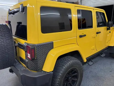 Jeep Wrangler Rubicon window tint: 15% rear half over factory privacy windows, 25% front doors (view 2)