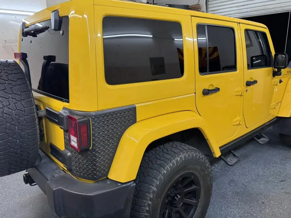 Jeep Wrangler Rubicon window tint: 15% rear half over factory privacy windows, 25% front doors (view 2)