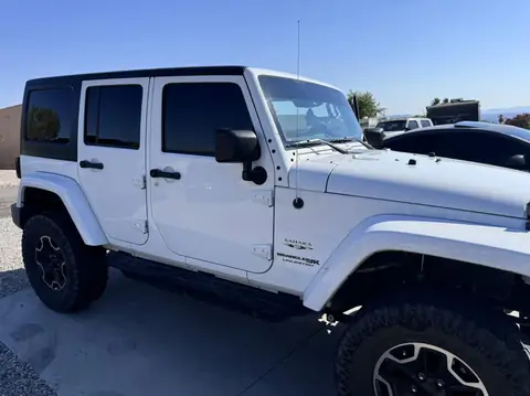 Jeep Wrangler window tint: 5% Carbon Ceramic rear doors and cargo windows, 15% Carbon Ceramic front doors, 5% Sunstrip (view 2)