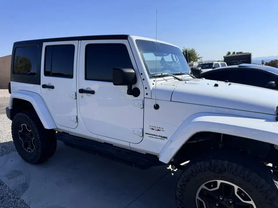 Jeep Wrangler window tint: 5% Carbon Ceramic rear doors and cargo windows, 15% Carbon Ceramic front doors, 5% Sunstrip (view 2)