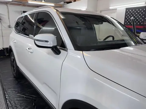 Kia Telluride window tint: Removed film from front doors, 5% all sides and rear, 5% sunstrip