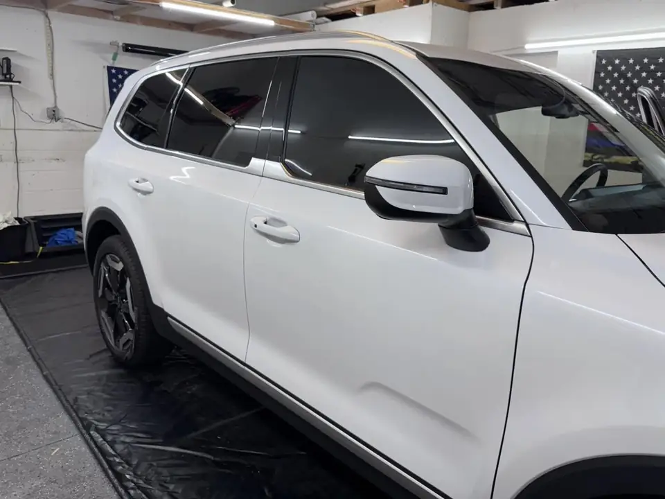 Kia Telluride window tint: Removed film from front doors, 5% all sides and rear, 5% sunstrip (view 2)