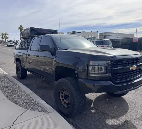 Lifted Chevy pickup window tint: 5% C-IR all around and sunstrip