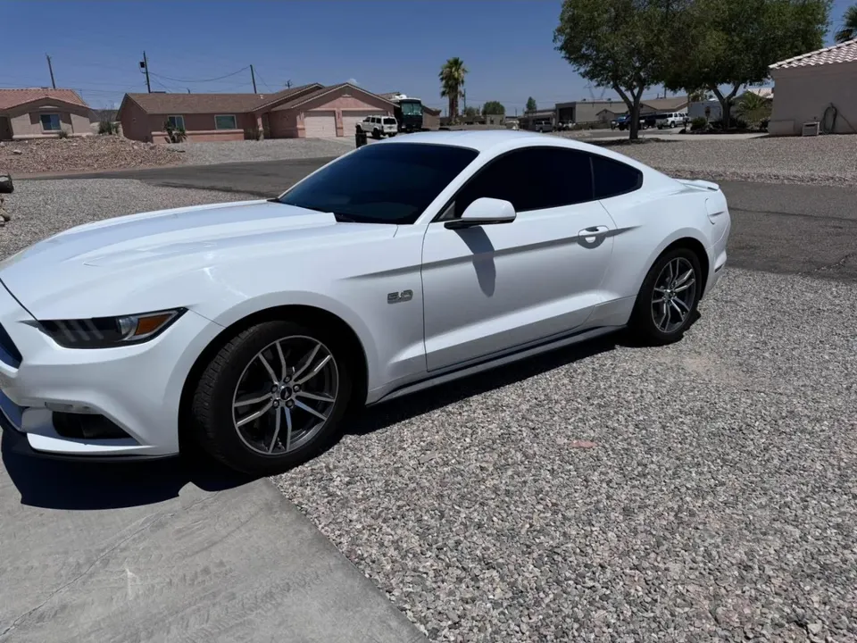 White Ford Mustang with tinted windows