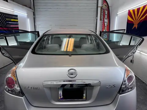 Nissan Altima window tint: 5% C-IR all around and sun strip (view 2)