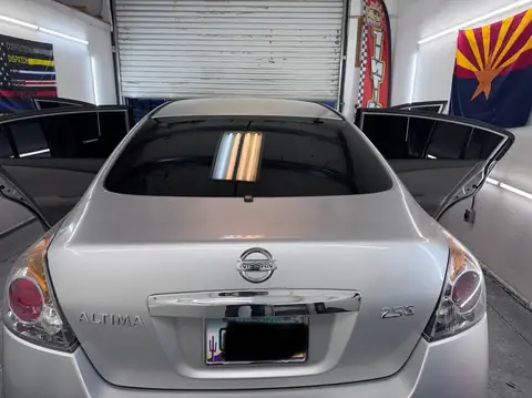 Nissan Altima window tint: 5% C-IR all around and sun strip (view 3)