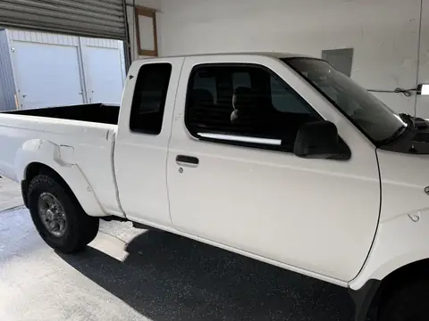 Nissan Frontier window tint: Remove old bubbly tint on front doors, New 35% installed on front doors