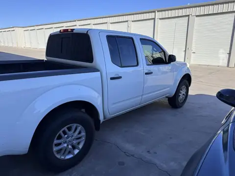 Nissan Frontier window tint: 5% over rear half privacy windows and sunstrip, 25% front doors