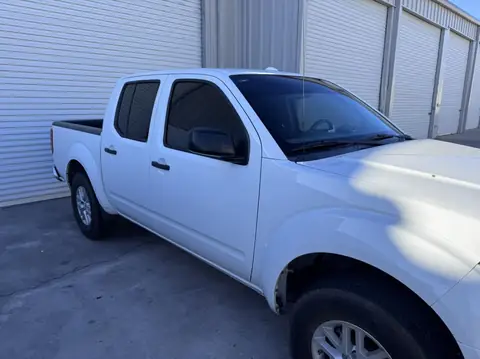 Nissan Frontier window tint: 5% over rear half privacy windows and sunstrip, 25% front doors (view 2)