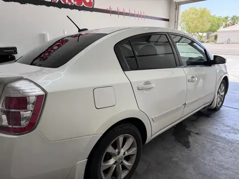 Nissan Sentra window tint: Full removal, 5% Carbon Ceramic rear 3 windows, 35% Carbon Ceramic front doors, 5% sunstrip
