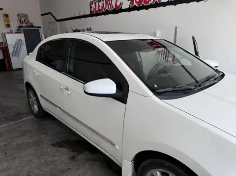 Nissan Sentra window tint: Full removal, 5% Carbon Ceramic rear 3 windows, 35% Carbon Ceramic front doors, 5% sunstrip (view 2)