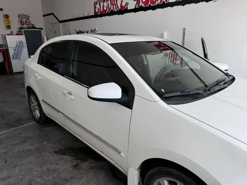 Nissan Sentra window tint: Full removal, 5% Carbon Ceramic rear 3 windows, 35% Carbon Ceramic front doors, 5% sunstrip (view 2)