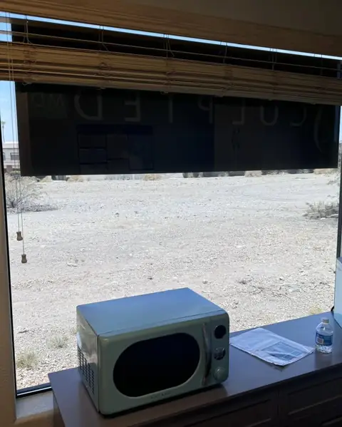 Office door and windows in dual reflective film: We installed our dual reflective 5% on the entry door and break room window, And installed our 35% (view 4)