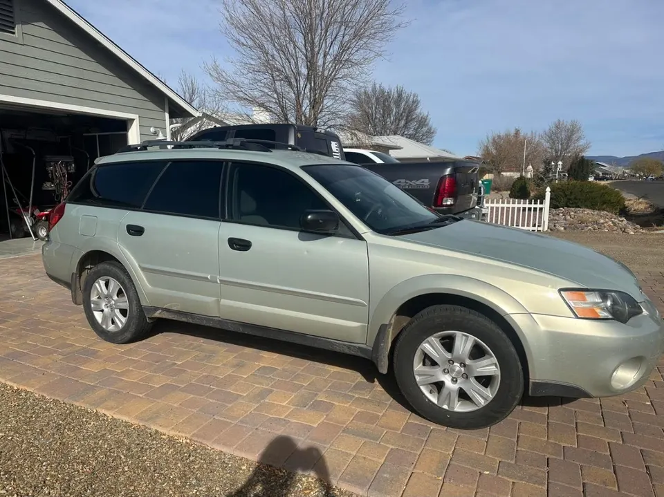 Subaru Outback tinted in a customer driveway