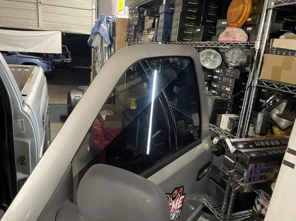 Ram 1500 single cab window tint: Fully custom install, Top and bottom brow on windshield, 20% top 1/3 of side windows, 5% bottom 2/3 of side windows (view 2)