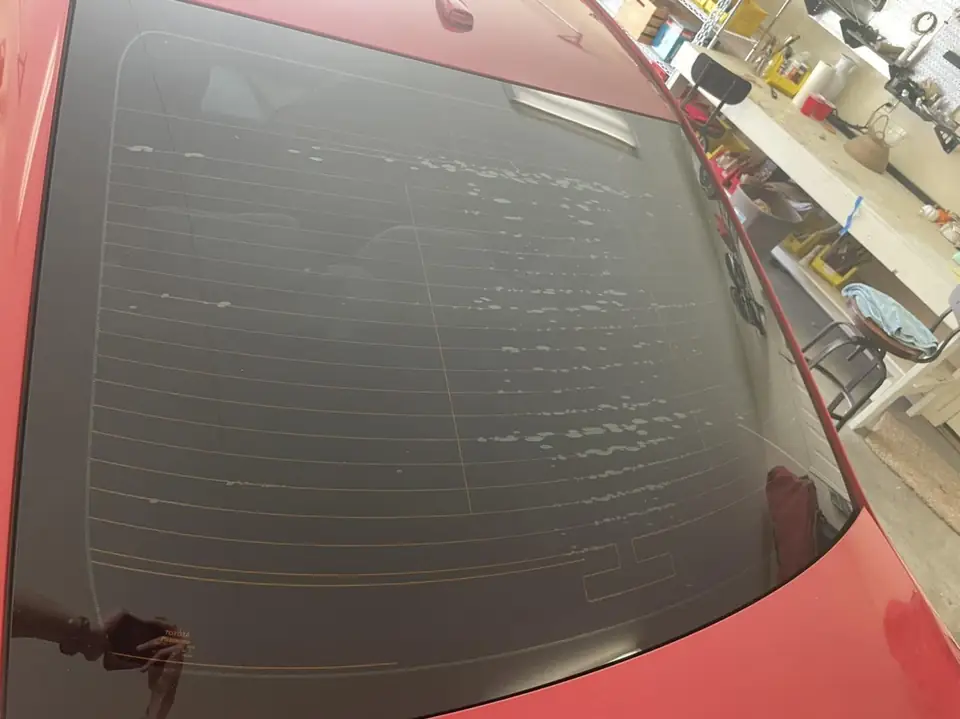 Red sedan window tint: Full vehicle removal of old-faded tint, Premium ceramic 15% all the way around, Premium ceramic 70% full windshield (view 2)