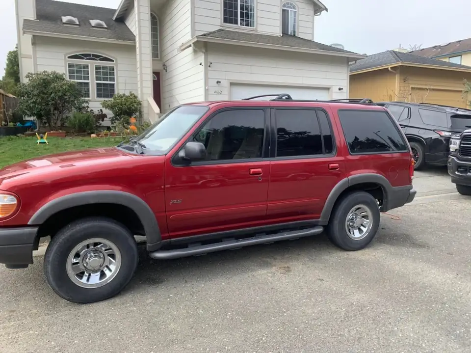 Red SUV window tint: Customer reached out had me install pre-cut they ordered 5% on the rear five windows 50% on the front two doors (view 2)