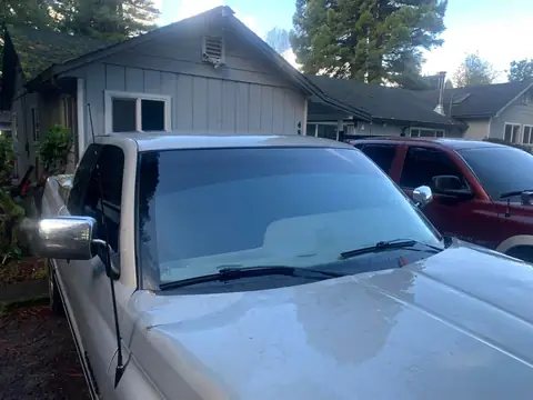 Silver pickup window tint: Little Christmas morning install. 11.5in 20% visor strip, 20% front and rear windows, 5% over the back windows/sliders