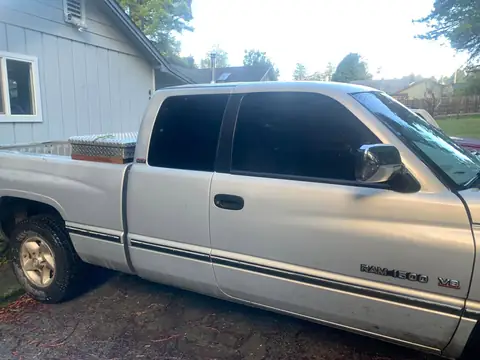 Silver pickup window tint: Little Christmas morning install. 11.5in 20% visor strip, 20% front and rear windows, 5% over the back windows/sliders (view 2)