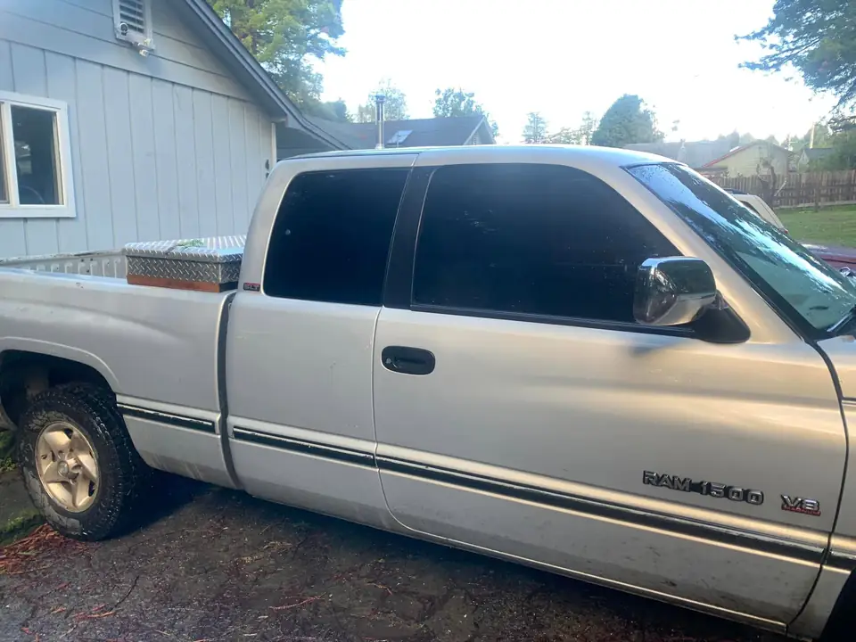 Silver pickup window tint: Little Christmas morning install. 11.5in 20% visor strip, 20% front and rear windows, 5% over the back windows/sliders (view 2)