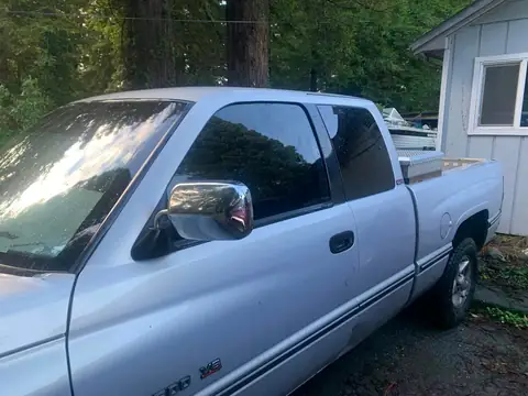 Silver pickup window tint: Little Christmas morning install. 11.5in 20% visor strip, 20% front and rear windows, 5% over the back windows/sliders (view 3)