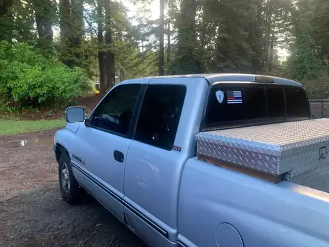 Silver pickup window tint: Little Christmas morning install. 11.5in 20% visor strip, 20% front and rear windows, 5% over the back windows/sliders (view 4)