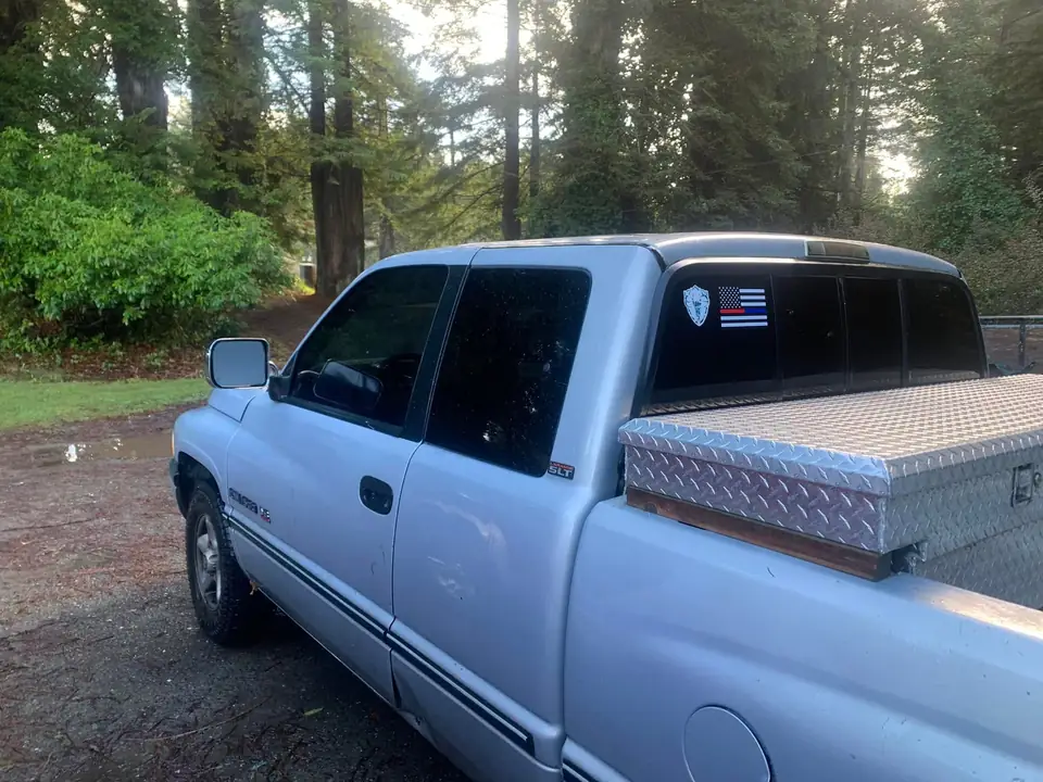 Silver pickup window tint: Little Christmas morning install. 11.5in 20% visor strip, 20% front and rear windows, 5% over the back windows/sliders (view 4)