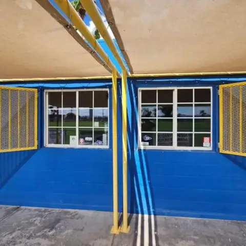 Snack shack windows in dual reflective film: Installed 25% dual reflective on 3 windows and 35% dual reflective on the main left sliding window