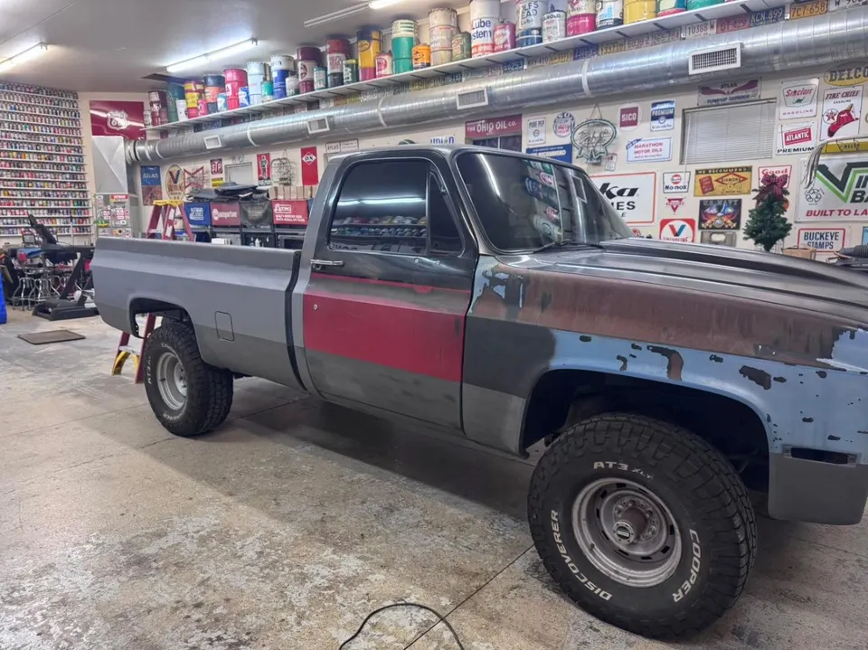 Classic square-body Chevy pickup in the shop for tint