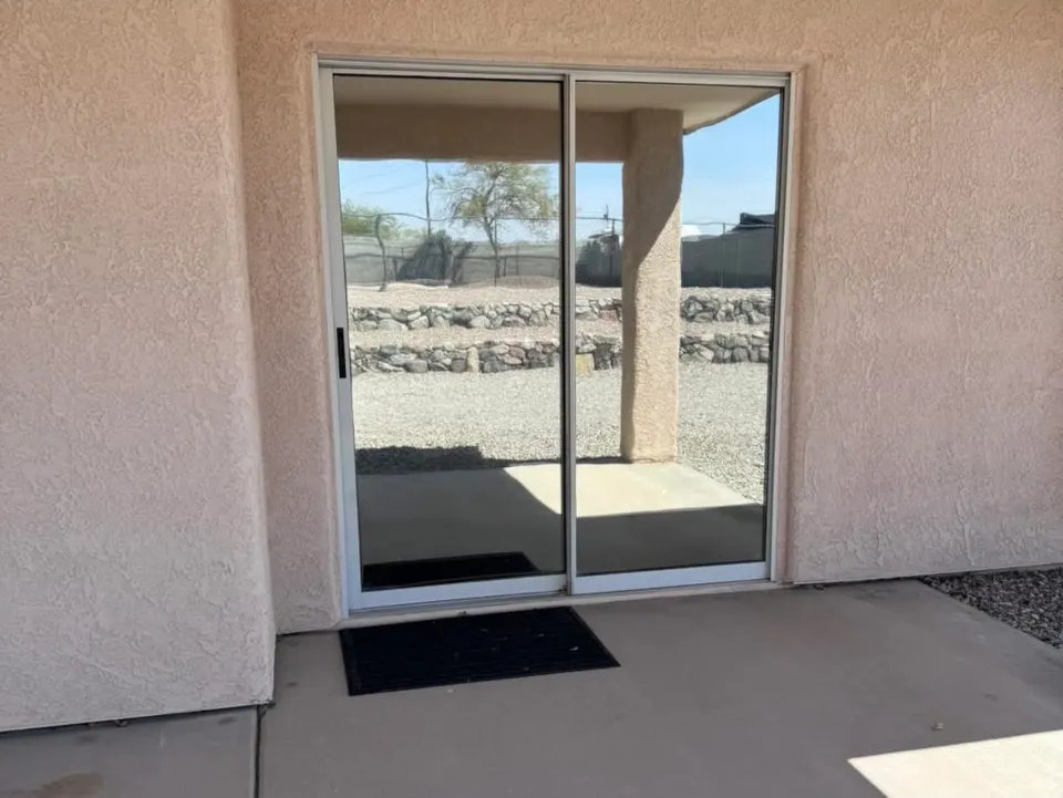 Commercial storefront entry door with window film