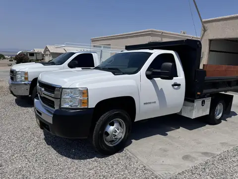 Two Chevy work trucks, window tint: 15% carbon ceramic rear window, 20% carbon ceramic side windows